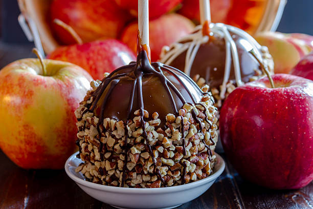 istock Hand Dipped Caramel Apples with Nuts and Chocolate 519642591