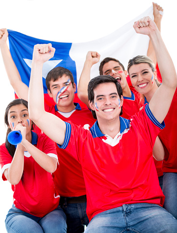 Group of Chilean football fans looking very happy
