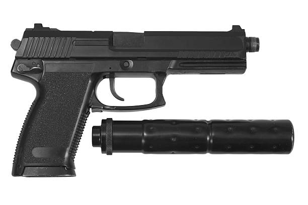 istock spy handgun with silencer on white background 519643911