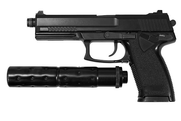 istock spy handgun with silencer on white background 519643955