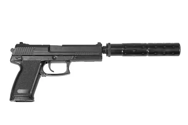 spy handgun with silencer on white background