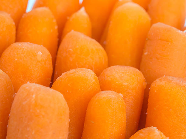 istock baby carrots background 519644535