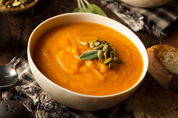 Homemade Autumn Butternut Squash Soup Homemade Autumn Butternut Squash Soup with Bread pumpkin soup photos stock pictures, royalty-free photos & images
