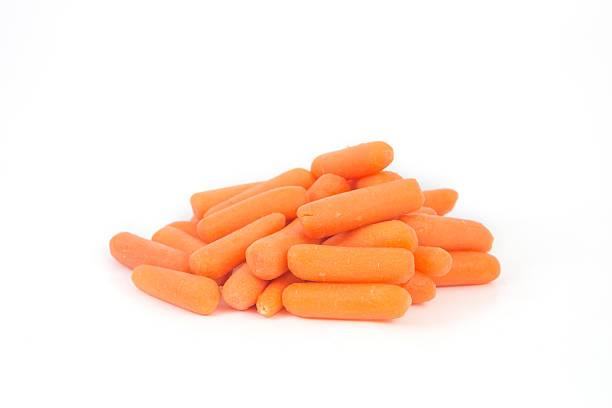 istock baby carrots on white background 519649271