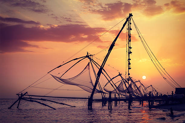 istock Chinese fishnets on sunset. Kochi, Kerala, India 519649511
