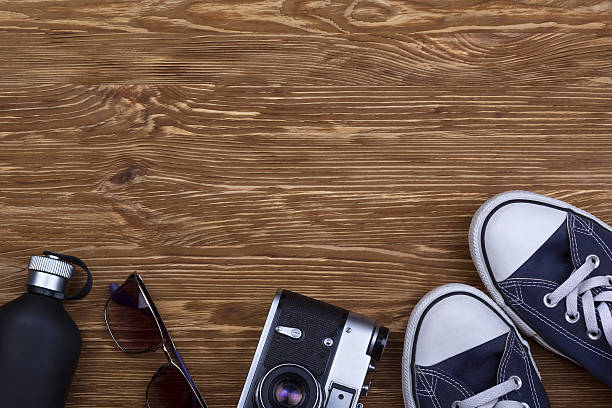 istock still life with sneakers, sunglasses, camera and perfume 519650694