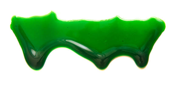 istock Drops of green paint on a white background 519651814