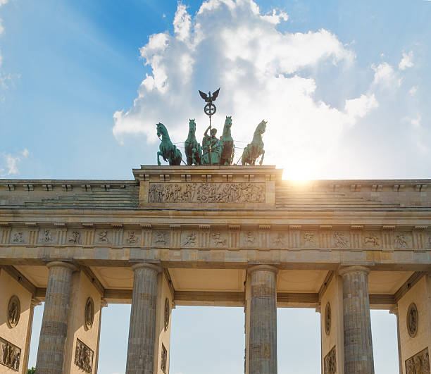 istock summer afternoon with sun backlit at Brandenburger Tor Berlin 519652432