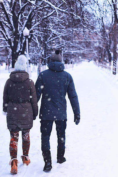 istock young couple walking winter 519652846