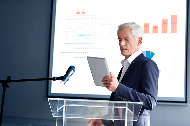 istock Senior businessman giving a speech 519654764