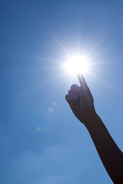 istock The sun and the hand 519656560