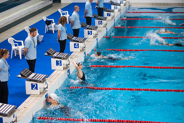 istock Female swimmers in swimming pool 519656616