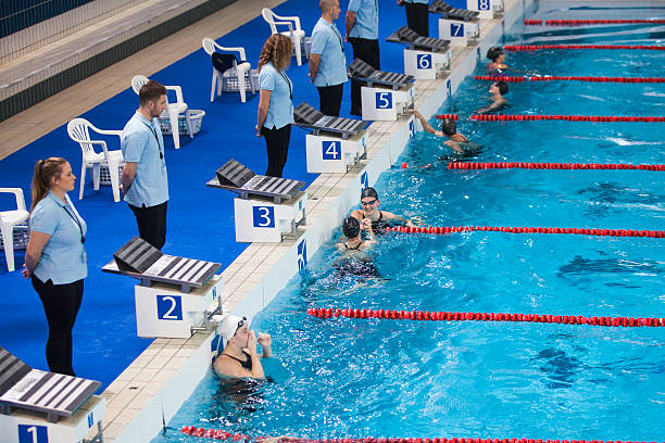 istock Female swimmers in swimming pool 519656836