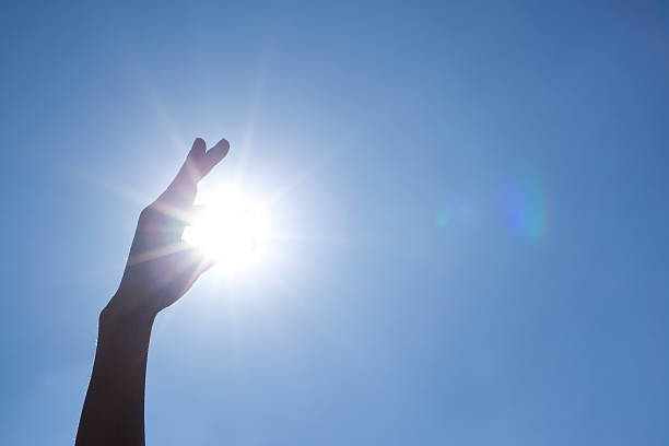 istock Light and the hand of the sun 519656870