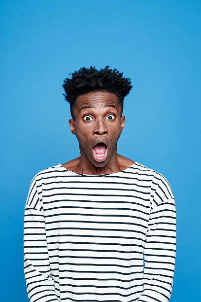 istock Shock, Afro american staring at camera with mouth open 519657166