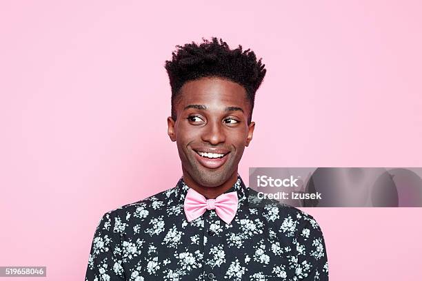 Funky Afro American Guy Against Pink Background Stock Photo - Download Image Now - Men, Portrait, Colored Background