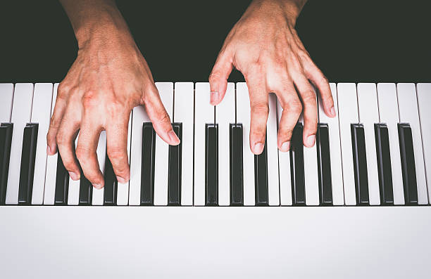 istock professional asian musician hands playing white piano 519658362