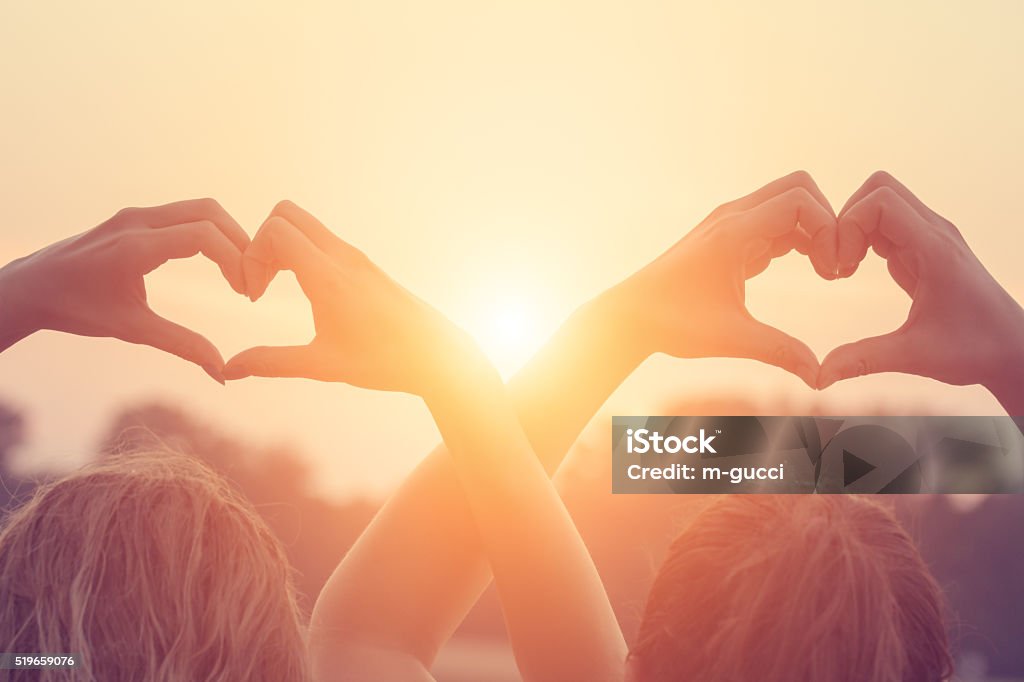 Heart-shape for the sun. Chasing the sun. Heart Shape Stock Photo