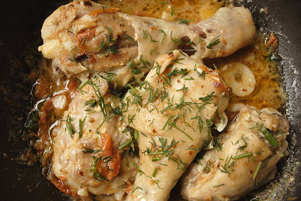 istock chicken fried with herbs in sauce 519659494