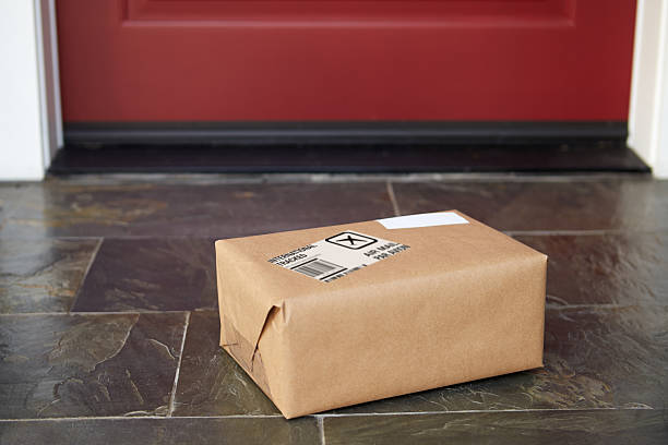 istock Close Up Of Parcel Delivery Outside Front Door 519660006