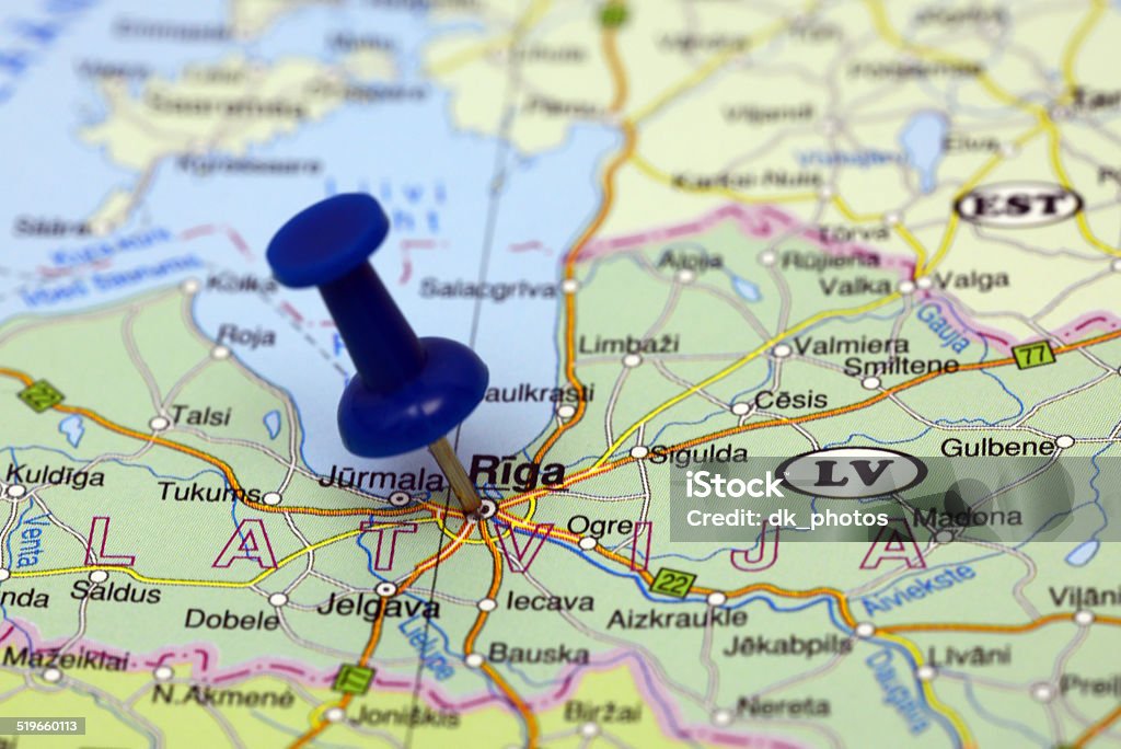 Riga pinned on a map of europe Photo of pinned Riga on a map of europe. May be used as illustration for traveling theme. Aiming Stock Photo