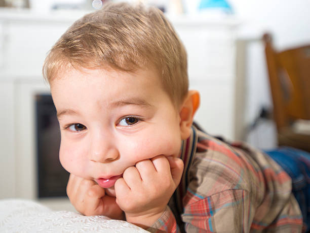 istock little boy lying on the floor and posing 519660808