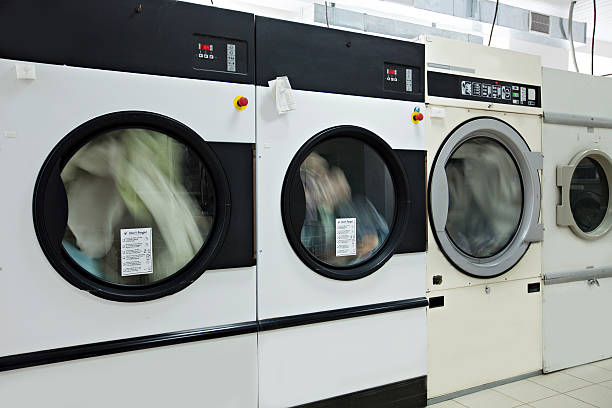 istock Running washing machines in laundry room 519661413
