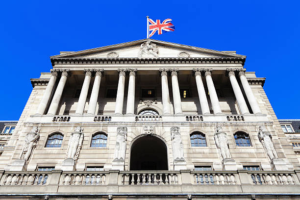 Bank of England Bank of England with flag, The historical building in London, UK bank of england stock pictures, royalty-free photos & images