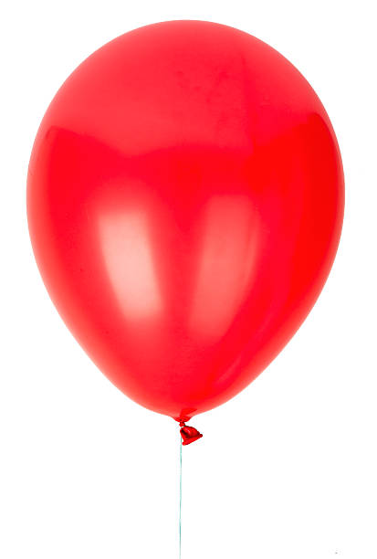 one isolated red balloon in snowy winter landscape