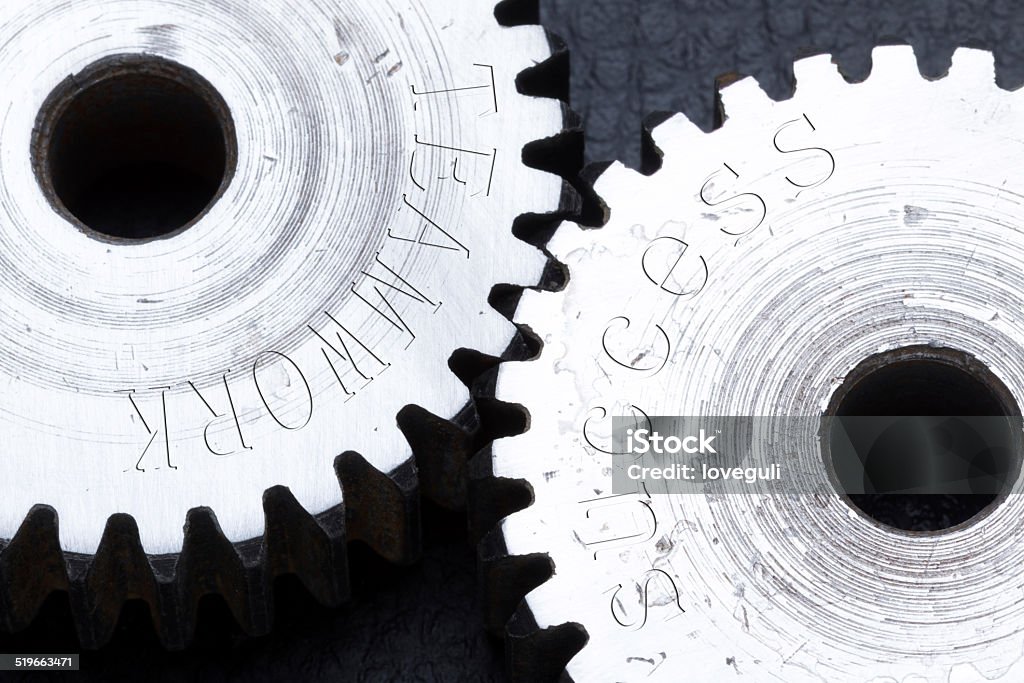 Gears machinery carved with teamwork success letters Business Stock Photo