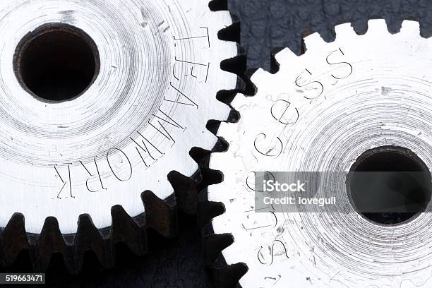 Gears Machinery Carved With Teamwork Success Letters Stock Photo - Download Image Now