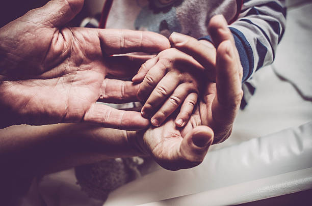 istock Mother and child holding hands 519663514