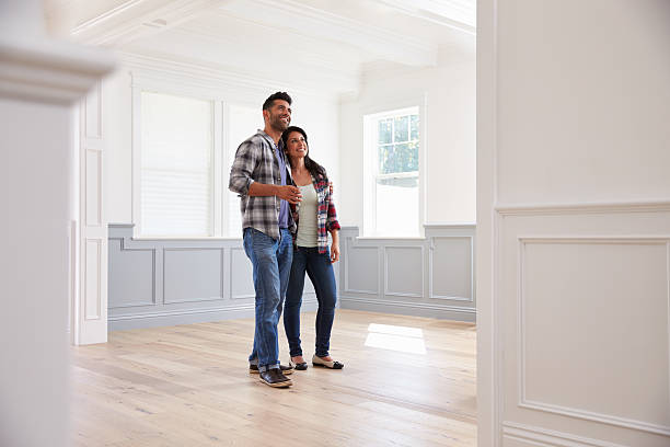 istock Hispanic Couple Viewing Potential New Home 519664048