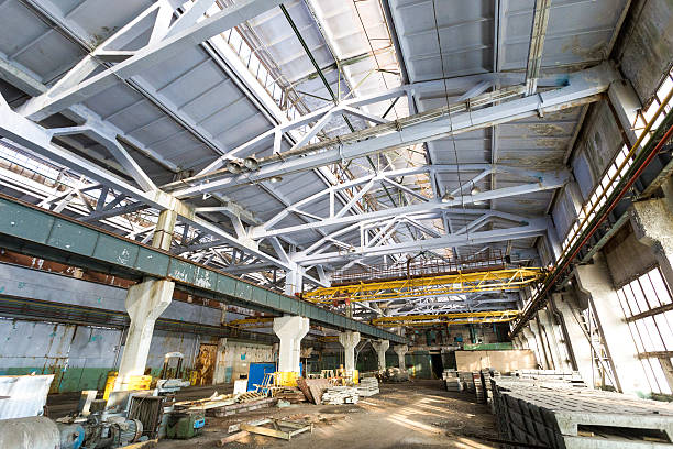 istock Old abandoned industrial factory warehouse at sunny day 519664258