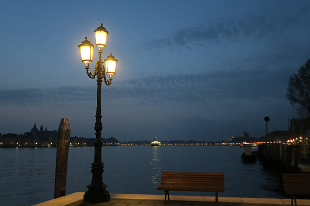 istock Giudecca Canal walkway  at night from Giudecca. 519664474