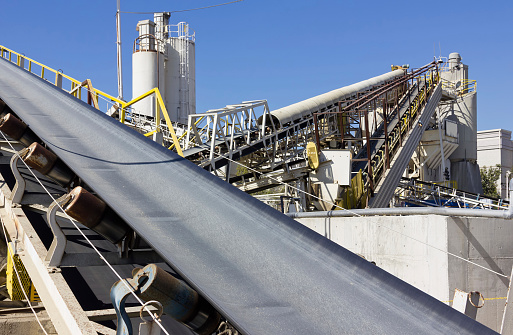 Multiple conveyor belts are used at a processing site.
