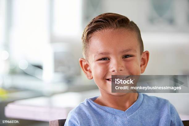 Head And Shoulders Portrait Of Smiling Hispanic Boy At Home Stock Photo - Download Image Now