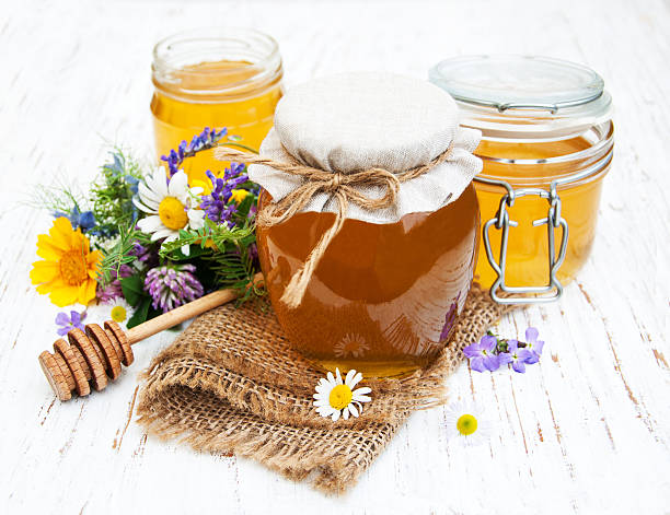istock Honey and wild flowers 519665158
