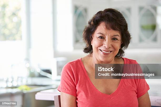 Head And Shoulders Portrait Of Senior Hispanic Woman At Home Stock Photo - Download Image Now