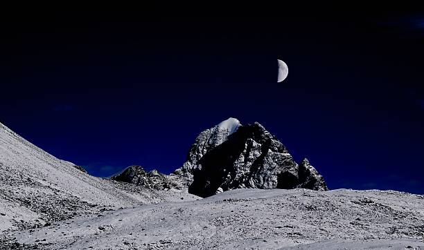 Moonrise on Snow Mount stock photo