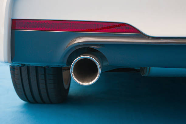 istock exhaust pipe of a white car on blue carpet 519665669