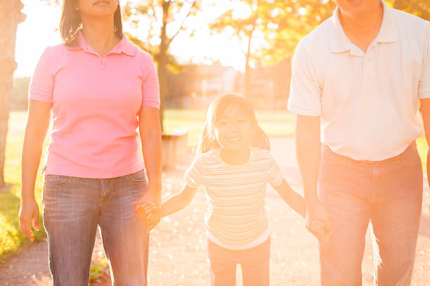istock A father and mother are walking with their little 519676588