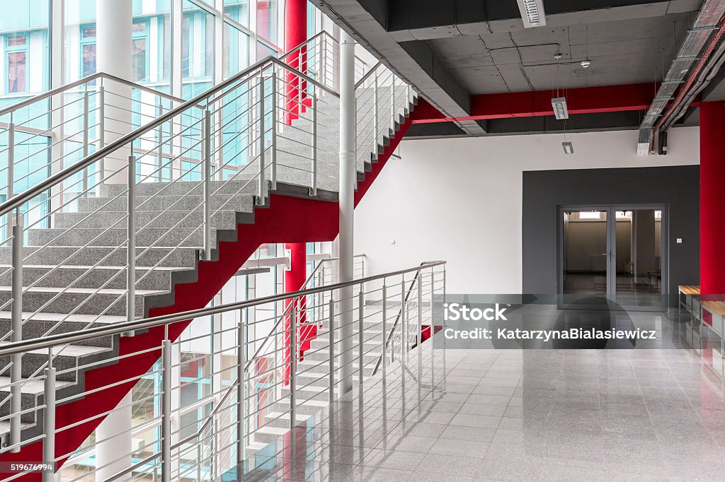 Place where study meets new architecture Modern, light staircase with silver railing, red details and black ceiling Indoors Stock Photo