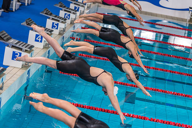 istock Female swimmer jumping 519678684