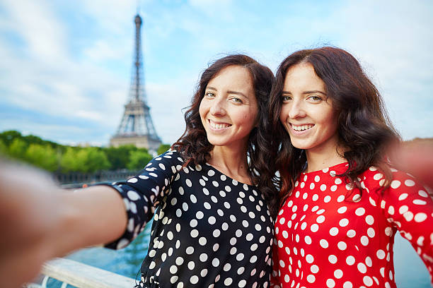 istock Beautiful twin sisters taking selfie 519679146
