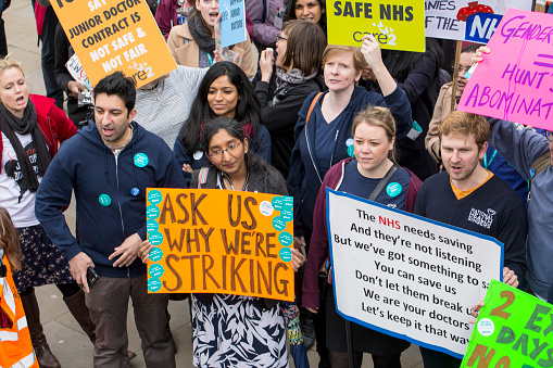 London, United Kingdom - April 6, 2016:  Singers, chanters, nurses, teachers, patients and lots of junior doctors turned up for the fourth Junior Doctors' strike rally.