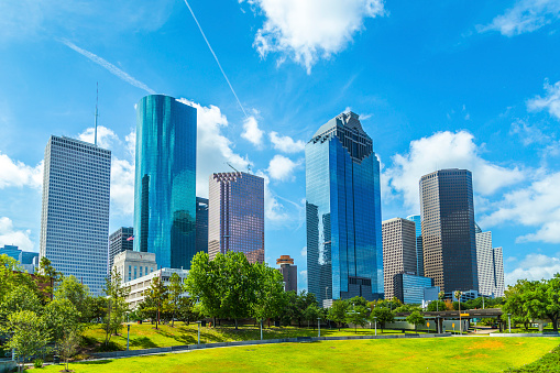 Aerial view of skyscrapers in downtown Houston against cloudy sky, Texas, USA.