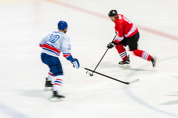 istock Men playing ice hockey 519681236