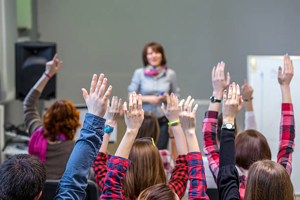 istock Active Students raising Arms up ready to answer Teachers Question 519682096