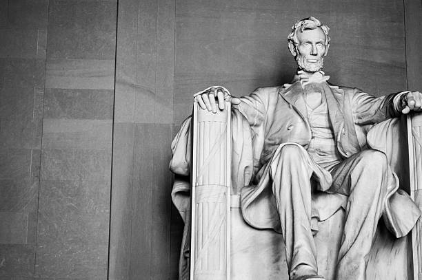 Abraham Lincoln memorial in Washington DC Imposing president Lincoln looking over the district. Black and white photo with perspective abraham lincoln stock pictures, royalty-free photos & images